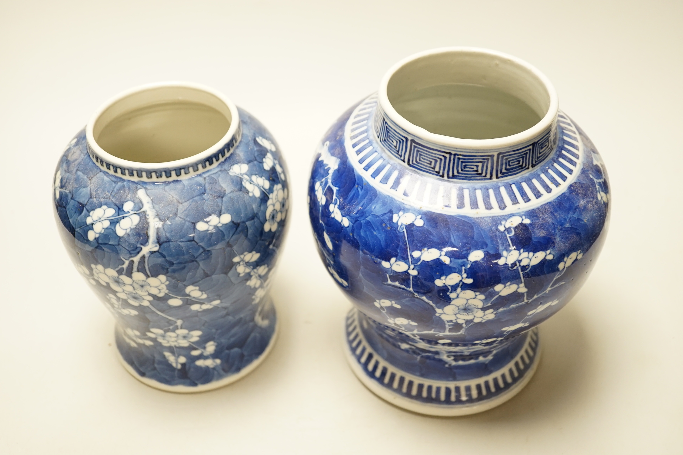 Two late 19th century Chinese blue and white prunus pattern vases, tallest 28cm high (a.f.)